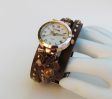 Montre or rose bracelet cuir marron breloques cuivrées
