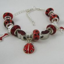 Bracelet argenté perles Coccinelle rouge