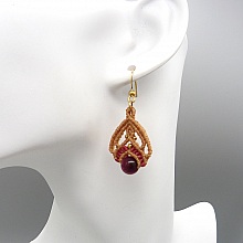Paire de boucles d'oreilles bleues avec des perles en oeil de tigre teinté