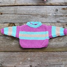 Pull poupée fuchsia, turquoise et marron clair