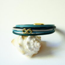 Bracelet multi-liens cuirs tons bleus décor infinir doré